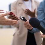 people taking interview outdoors